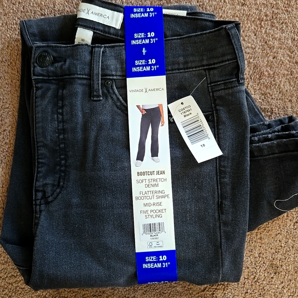 Brand New Black Denim Flared Leg Jeans.